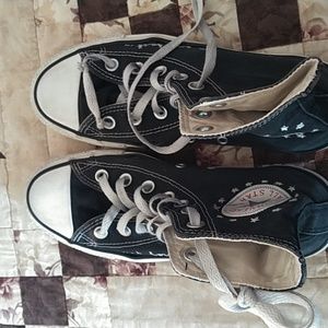 Chuck Taylor. Converse All Star. Size 5 men, 7 women. Black.